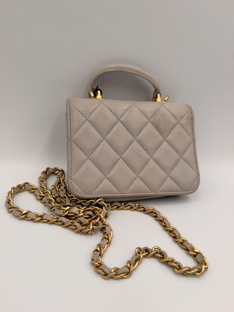 Chanel Mini Classic Flap with Top Handle — Light Blue Lambskin Aged Gold Hardware