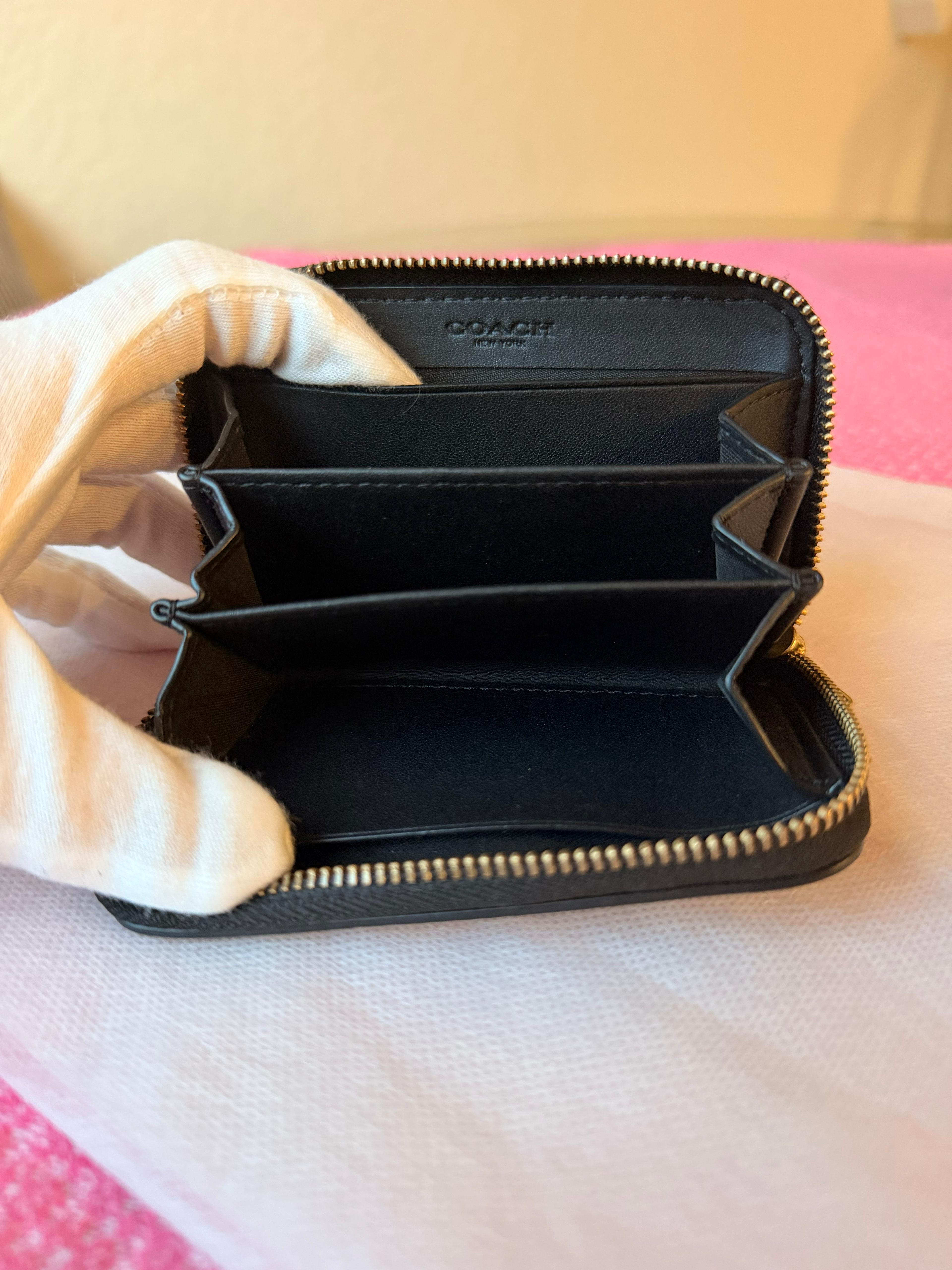 Coach small zip-around wallet black leather — logo detail